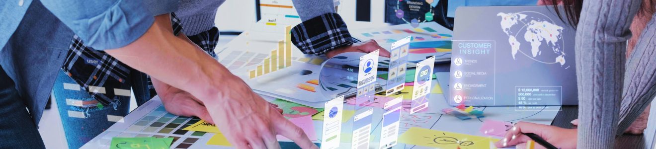 Close up ux developer and ui designer use augmented reality app brainstorming about mobile interface wireframe design on desk at modern office.Creative digital development agency